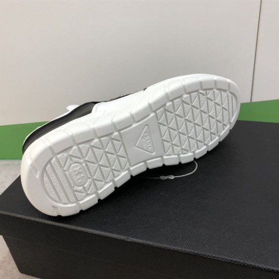Prada Leather Low Top Trainers In Black And White - Sole Tread Underside view displaying geometric tread pattern of white rubber sole on Prada trainer in black and white