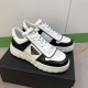 Prada Leather Low Top Trainers In Black And White - Pair View Pair of Prada black and white leather low top trainers resting on shoe box