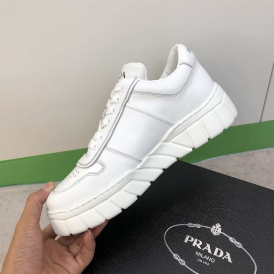 Prada Leather Low Top Chunky Soles Trainers White In-Hand View Hand holding Prada Leather Low Top Chunky Soles Trainers White showing medial quarter