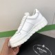 Prada Leather Low Top Chunky Soles Trainers White In-Hand View Hand holding Prada Leather Low Top Chunky Soles Trainers White showing medial quarter