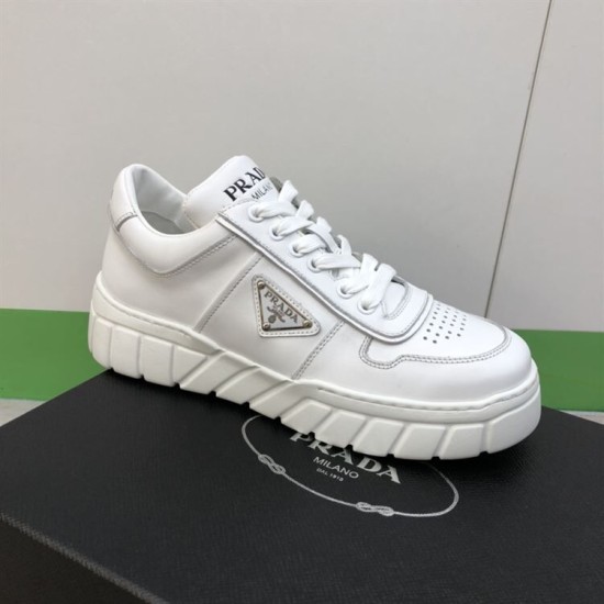 Prada Leather Low Top Chunky Soles Trainers White Perspective View Lateral perspective of Prada Leather Low Top Chunky Soles Trainers White resting on shoe box