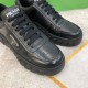 Prada Black Leather Trainer Toe Box and Laces Detail Close-up angled view of toe box, laces, and side logo on Prada black leather trainer