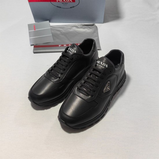 Prada Black Leather Low Top Trainers Side Perspective Pair of Prada Black Leather Low Top Trainers side perspective with dust bag