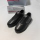 Prada Black Leather Low Top Trainers Side Perspective Pair of Prada Black Leather Low Top Trainers side perspective with dust bag