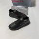 Prada Black Leather Low Top Trainers Front Angle Prada Black Leather Low Top Trainers angled front view showing triangle emblem
