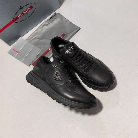 Prada Black Leather Low Top Trainers with Accessories Prada Black Leather Low Top Trainers full view alongside designer box and accessories
