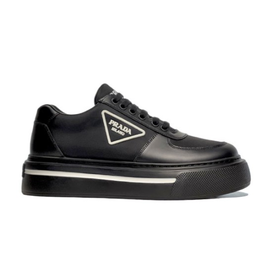 Black Prada Re-Nylon Platform Trainer Side View in black and white Lateral side view of black Prada Macro Re-Nylon and brushed leather trainers featuring a platform sole and white triangle logo.