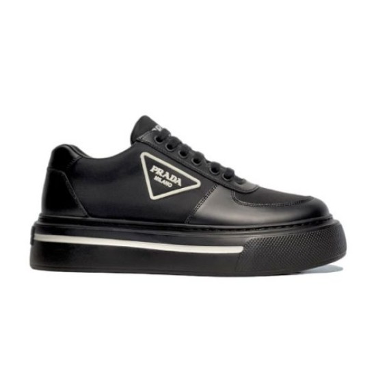 Studio Side Profile of Black Prada Platform Trainer in black and white Studio profile shot of a single black Prada Macro Re-Nylon and brushed leather trainer on a plain white background.