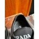 Prada Tongue Logo Detail on Black Trainer in black and white Close-up of the black padded tongue printed with Prada Milano branding in white lettering.
