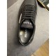 Interior Insole Branding of Prada Black Trainer in black and white Close-up view inside the collar and insole of a black Prada trainer with visible branding and care sticker in black and white