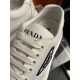 Prada Trainer Tongue Logo Detail in off-white Close-up of off-white Prada trainer tongue logo and lacing