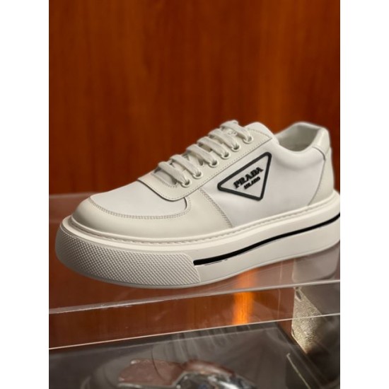 Prada Platform Trainer Three-Quarter View in off-white Three-quarter view of off-white Prada platform trainer with triangle logo