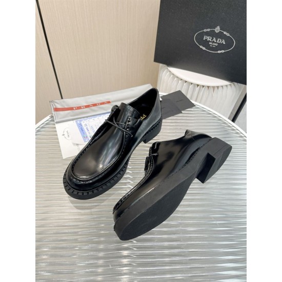 Prada Brushed Leather Monolith Shoes Perspective View in black Top and side view of black Prada monolith lace-up shoes with outsole detail
