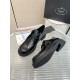 Prada Brushed Leather Monolith Shoes Perspective View in black Top and side view of black Prada monolith lace-up shoes with outsole detail
