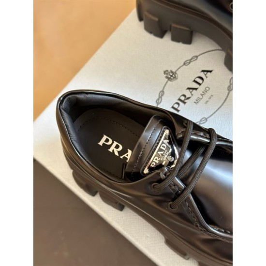 Close-up of tongue detail on Prada Monolith black leather lace-up shoe
