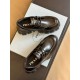 Overhead view of pair of black Prada Monolith leather shoes