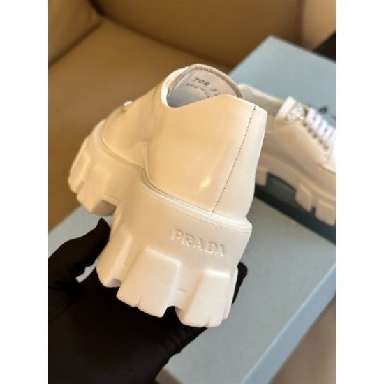 Prada Monolith White Shoe Heel Branding Heel angle view of white Prada Monolith shoe showing embossed brand logo on outsole