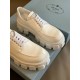 Prada Monolith White Shoes Front Detail Front toe perspective of Prada Monolith white lace-up shoes with thick tread