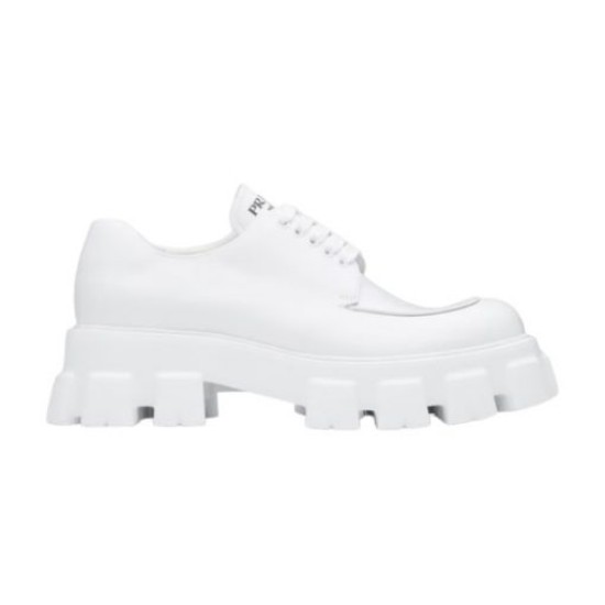 Prada Monolith White Shoe Lateral Profile Lateral view of Prada Monolith white leather lace-up shoe against plain backdrop