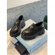 Prada Monolith Loafers Front Perspective in black Front high-angle perspective of Prada black brushed leather Monolith loafers
