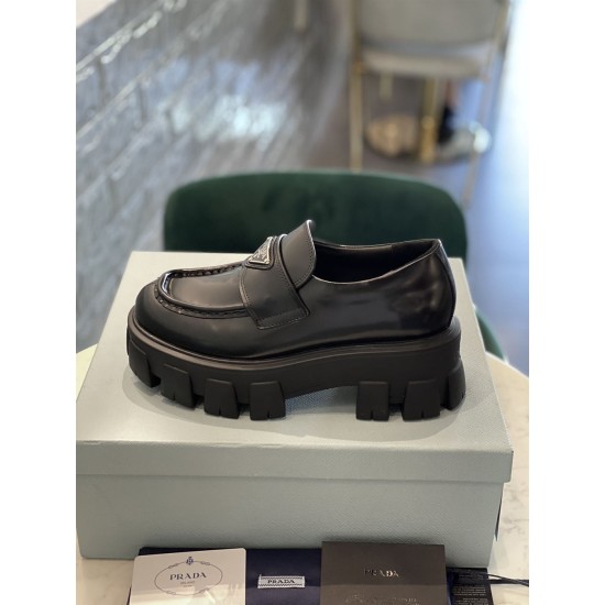 Prada Monolith Loafer Box Side Profile in black Side profile view of a single Prada Monolith black loafer sitting on a box