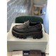 Prada Monolith Loafer Box Side Profile in black Side profile view of a single Prada Monolith black loafer sitting on a box