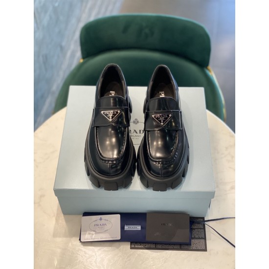 Prada Monolith Loafers Direct Front View in black Direct front view of Prada Monolith loafers showcasing enamel triangle logos in black