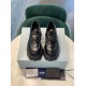 Prada Monolith Loafers Direct Front View in black Direct front view of Prada Monolith loafers showcasing enamel triangle logos in black