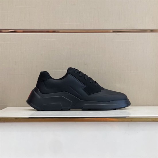 Prada Polarius Black Low Top Shelf View in black and white Lateral side view of black Prada Polarius trainer resting on a display shelf in black and white