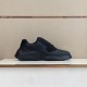 Prada Polarius Black Low Top Shelf View in black and white Lateral side view of black Prada Polarius trainer resting on a display shelf in black and white