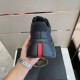 Prada Polarius Black Trainer Heel Detail in black and white Rear view showing black heel cup and signature red vertical logo stripe in black and white