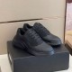 Prada Polarius Trainers Front Three-Quarter View in black and white Angled perspective of both black Prada Polarius trainers placed on top of shoebox in black and white