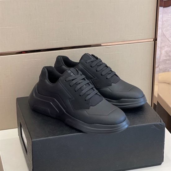Prada Polarius Black Trainers Pair in black and white Pair of Prada Polarius black trainers sitting on a black shoebox angled right in black and white