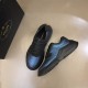 Prada Iridescent Blue Low Top Trainers Packaging View in blue and white Prada Iridescent Blue Low Top Trainers displayed at an angle beside branded packaging in blue and white