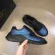 Prada Iridescent Blue Low Top Trainers Angled Profile in blue and white Hand holding Prada Iridescent Blue Low Top Trainers alongside a shoe showing the toe box in blue and white