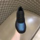 Prada Iridescent Blue Low Top Trainers Front View in blue and white Hand holding Prada Iridescent Blue Low Top Trainers showing front toe panel and laces in blue and white