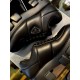 Prada Black Padded Trainer Side Detail Close-up side detail of two Prada black padded leather trainers showcasing stitch lines and enamel triangle logo
