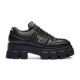 Prada Black Chunky Sole Leather Trainer Studio View Full side view of black Prada soft padded nappa leather trainer with chunky platform sole against white background