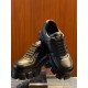Prada Black Leather Trainers Front Angle View Front elevated angle of black Prada soft padded leather trainers showing lace arrangement and lugged soles