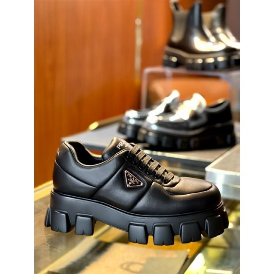 Prada Black Chunky Sole Leather Trainer Profile Side view of Prada black soft padded leather trainer highlighting the metal triangle emblem and platform sole
