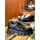 Prada Black Chunky Sole Leather Trainer Profile Side view of Prada black soft padded leather trainer highlighting the metal triangle emblem and platform sole