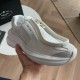 Prada White Trainer Side Branding Detail Close-up hand holding side of Prada white trainer showing side branding and chunky sole