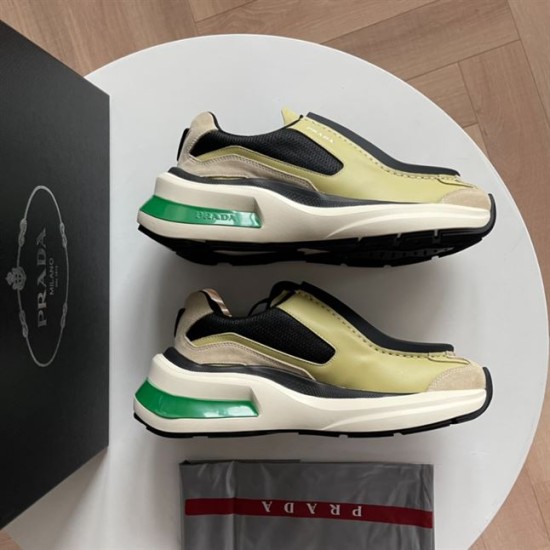 Prada Systeme Yellow Suede Leather Trainers Pair Side View Pair of Prada Systeme yellow suede leather chunky trainers side view