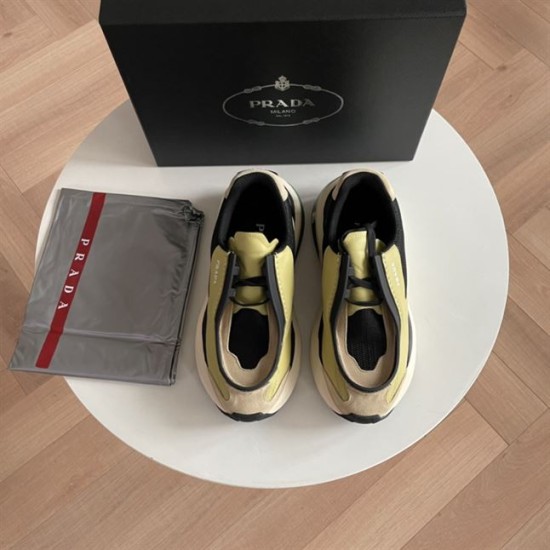Prada Systeme Yellow Leather Trainers Overhead Pair View Top view of Prada Systeme yellow leather trainers beside branded box