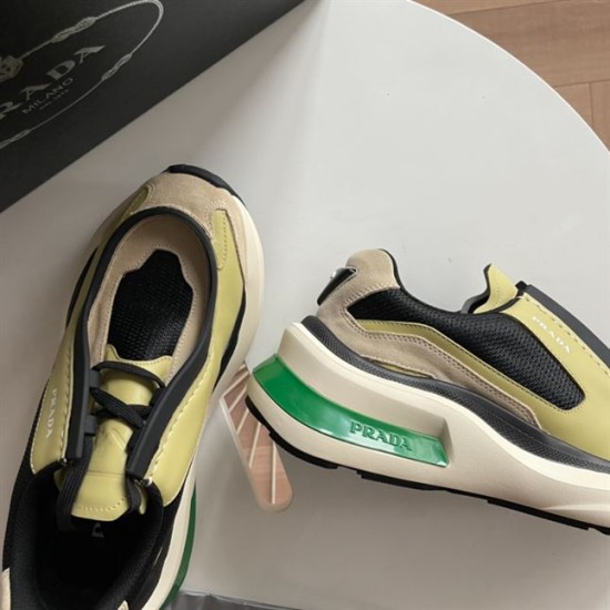 Prada Systeme Yellow Trainer Green Midsole Detail Close-up of Prada Systeme yellow trainer sole and green heel detail