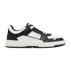 Isolated side view of the Valentino Freedots low-top leather trainer in black and white against a plain background.