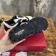 Underside view displaying the tread pattern and embossed branding on the sole of a Valentino Freedots trainer in black and white