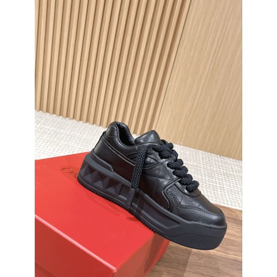 Valentino One Stud XL Black Leather Trainer Profile View Side profile of Valentino One Stud XL black leather trainer resting on red box