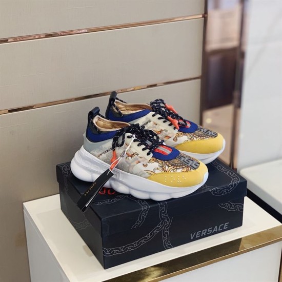 Versace Chain Reaction Trainers Box Set View in yellow and white Side angled view of multicoloured Versace Chain Reaction Trainers sitting on black shoebox in yellow and white