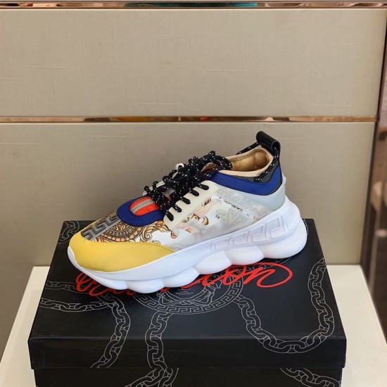 Versace Chain Reaction Trainer Outer Profile in yellow and white Lateral side view of Versace Chain Reaction Trainer with baroque pattern and translucent cage in yellow and white